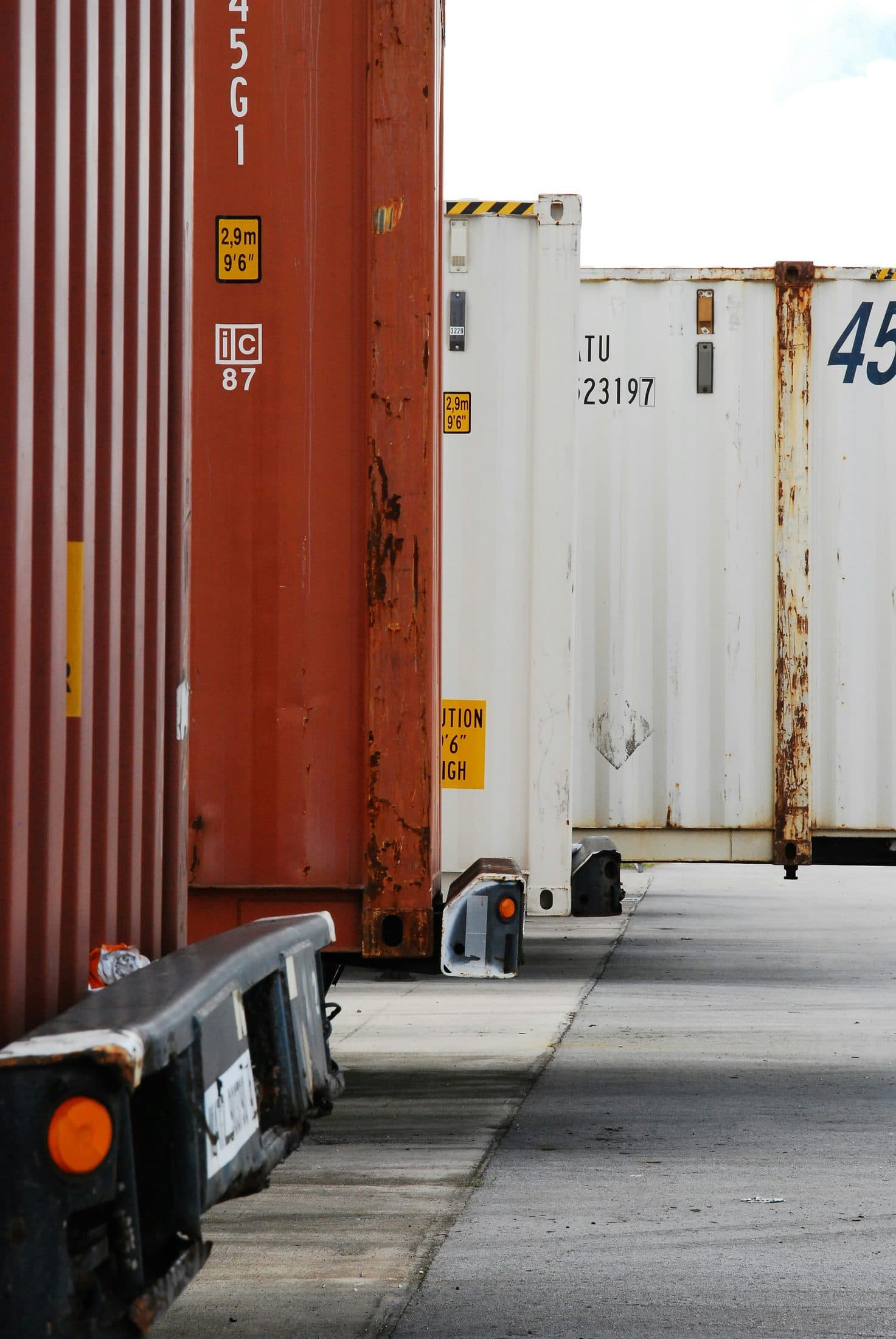 Close-up of stacked shipping containers at a freight yard